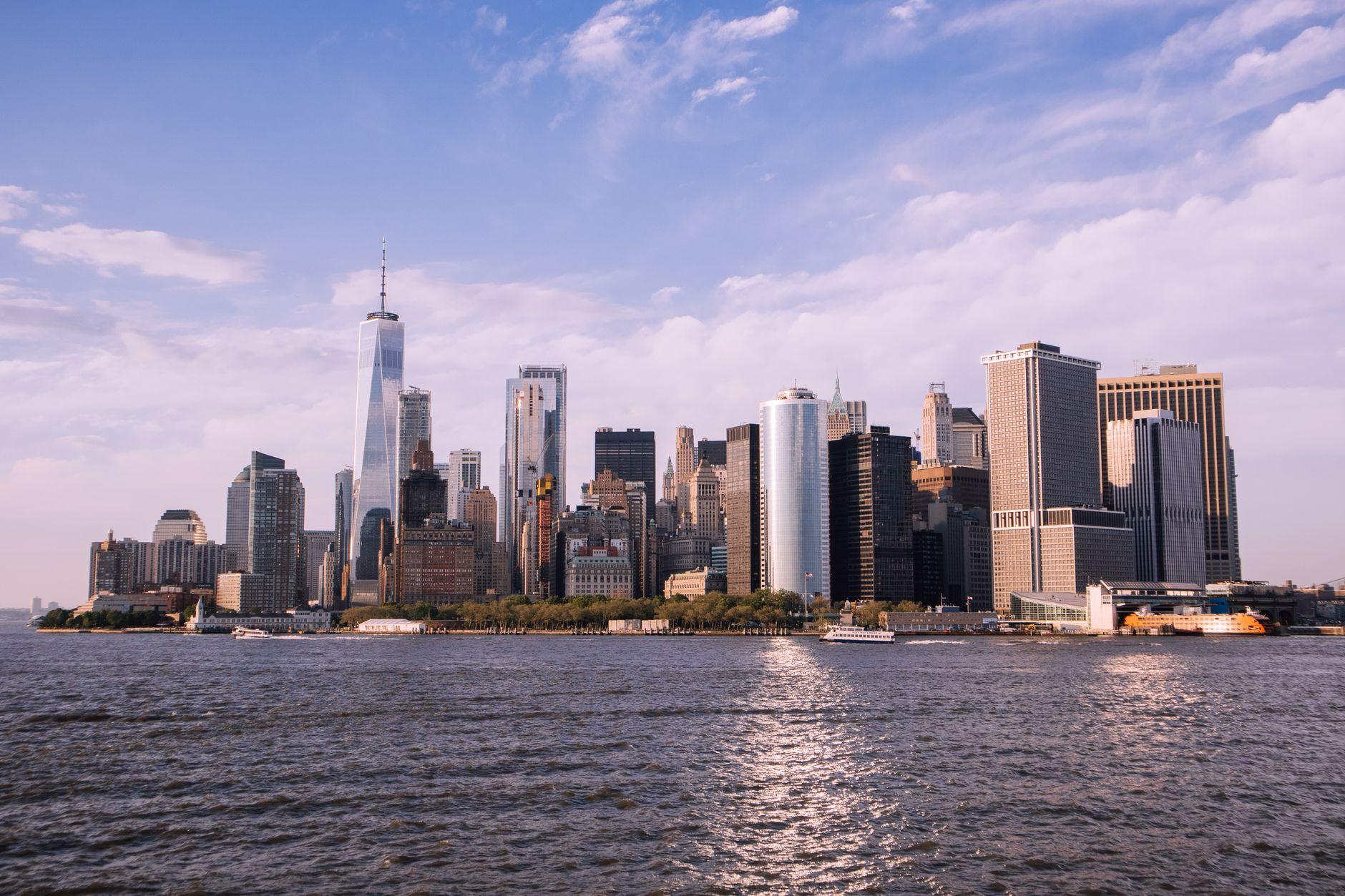 Scenic view of Manhattan skyline and Hudson River with clear sky.